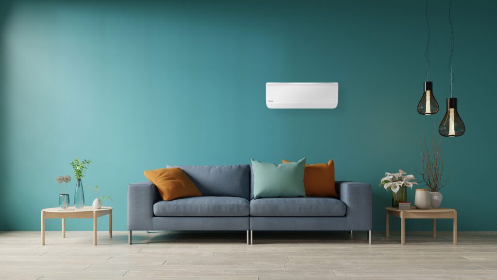 Living room with reverse cycle split on wall above sofa